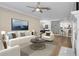 Bright living room with hardwood floors, fireplace, and comfortable seating arrangement at 2400 Cumberland Se Pkwy # 212, Atlanta, GA 30339