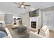 Bright living room with fireplace, hardwood floors, and comfortable seating at 2400 Cumberland Se Pkwy # 212, Atlanta, GA 30339