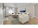 Living room with hardwood floors, fireplace, and neutral color palette at 2400 Cumberland Se Pkwy # 212, Atlanta, GA 30339