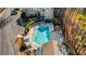 Aerial view of the community pool, surrounded by lounge chairs at 2400 Cumberland Se Pkwy # 212, Atlanta, GA 30339