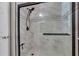 Modern bathroom shower featuring a glass door and sleek tiling at 2400 Cumberland Se Pkwy # 212, Atlanta, GA 30339