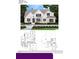 Charming two-story home featuring a symmetrical facade, arched entryway, and neatly manicured landscaping at 7414 Big Creek Dr, Douglasville, GA 30135
