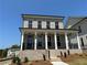 Charming two-story home with brick facade, covered porch, and professional landscaping at 118 Stonehouse Drive Way, Cumming, GA 30040