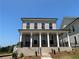 Charming two-story home with brick facade, covered porch, and professional landscaping at 118 Stonehouse Drive Way, Cumming, GA 30040