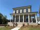 Charming two-story home with brick facade, covered porch and black railing at 118 Stonehouse Drive Way, Cumming, GA 30040