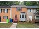 Charming townhome exterior with a brick facade, bay window and inviting red door at 134 Springstead Ct, Marietta, GA 30060