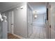 Hallway leading to a dining area with tile flooring and natural light at 134 Springstead Ct, Marietta, GA 30060