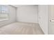 Bright bedroom with a large window and neutral carpet at 801 Dobby Way (Lot 92), Mcdonough, GA 30252
