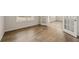Spacious room with hardwood floors, a window, french doors, and neutral walls, offering a versatile living space at 801 Dobby Way (Lot 92), Mcdonough, GA 30252