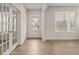 Bright foyer with hardwood flooring, glass french doors, and large windows, creating a welcoming entrance at 801 Dobby Way (Lot 92), Mcdonough, GA 30252