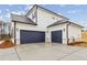 Spacious two-car garage with blue doors and a well-finished concrete driveway, offering ample parking space at 801 Dobby Way (Lot 92), Mcdonough, GA 30252