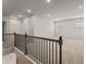 Open hallway upstairs, bright and spacious with an open window and railing at 801 Dobby Way (Lot 92), Mcdonough, GA 30252