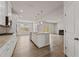 Spacious kitchen with stainless steel appliances and a view to the living room and fireplace at 801 Dobby Way (Lot 92), Mcdonough, GA 30252