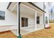 Covered patio with white columns, a white ceiling, and a concrete floor at 801 Dobby Way (Lot 92), Mcdonough, GA 30252