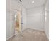 Walk-in closet with shelving units and carpeted floor, offering ample storage space and organization possibilities at 801 Dobby Way (Lot 92), Mcdonough, GA 30252