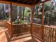 Inviting back deck with brown wood and a tranquil wooded view, perfect for relaxation and outdoor enjoyment at 2860 Pine St, Duluth, GA 30096