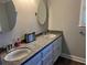Bathroom featuring double sinks with granite counters, offering both style and functionality at 2860 Pine St, Duluth, GA 30096