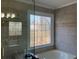 Bathroom with large tub and window with decorative glass above, providing privacy and light at 2860 Pine St, Duluth, GA 30096