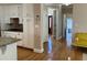 View of the hardwood hallway extending from kitchen to other areas of the home at 2860 Pine St, Duluth, GA 30096