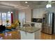 Open kitchen featuring granite counters, stainless appliances, and a breakfast nook with natural light at 2860 Pine St, Duluth, GA 30096