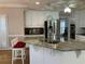 A kitchen boasts granite countertops, stainless steel appliances, and white cabinets at 2860 Pine St, Duluth, GA 30096