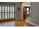 Bright living room with hardwood floors and a large window offering plenty of natural light at 2860 Pine St, Duluth, GA 30096