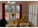 Comfortable living area featuring shuttered windows, view of deck, and brightly colored furniture at 2860 Pine St, Duluth, GA 30096