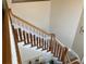 Classic staircase with wooden railings and white spindles leading to the upper level of the home at 2860 Pine St, Duluth, GA 30096
