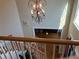 Elegant staircase with hardwood steps and white spindles leading to the main level of the home at 2860 Pine St, Duluth, GA 30096