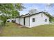 Exterior view of the home's backyard, surrounded by lush greenery and a wood privacy fence at 43 George Lemon Dr, Mcdonough, GA 30253