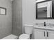 Charming bathroom features stylish tiling in the shower and granite countertops at 43 George Lemon Dr, Mcdonough, GA 30253