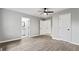 Spacious bedroom with hardwood floors, ceiling fan and multiple closets at 43 George Lemon Dr, Mcdonough, GA 30253
