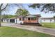 Charming white-painted home with a covered porch and black garage door at 43 George Lemon Dr, Mcdonough, GA 30253