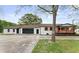 Charming white-painted home with a covered porch, black garage door, and inviting curb appeal at 43 George Lemon Dr, Mcdonough, GA 30253