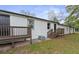 Back of the house featuring a newly installed deck with staircase leading to the backyard at 43 George Lemon Dr, Mcdonough, GA 30253
