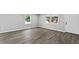 A bright living room with hardwood floors and white trim is perfect for entertaining guests at 43 George Lemon Dr, Mcdonough, GA 30253