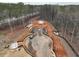 Aerial view of the construction site showing the parking and perimeter of a wooded lot at 4521 Twinberry Dr, Powder Springs, GA 30127