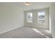 Bright and airy bedroom with carpet and windows overlooking the yard at 4521 Twinberry Dr, Powder Springs, GA 30127