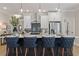 Modern kitchen with white cabinets, stainless appliances, pendant lighting, and breakfast bar with seating at 4521 Twinberry Dr, Powder Springs, GA 30127