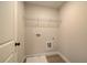 Functional laundry room with washer/dryer hookups, and shelving for storage at 4521 Twinberry Dr, Powder Springs, GA 30127