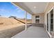 Covered back patio and backyard with a view of the adjacent lots at 809 Dobby Way (Lot 94), Mcdonough, GA 30252