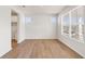Bright, airy room with hardwood floors, white trim, and large windows at 809 Dobby Way (Lot 94), Mcdonough, GA 30252