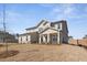 Charming home featuring a covered porch with stone accents and neutral siding at 809 Dobby Way (Lot 94), Mcdonough, GA 30252