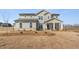 Inviting two-story home with stone accents and a welcoming front porch at 809 Dobby Way (Lot 94), Mcdonough, GA 30252
