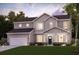 Beautiful home with well-manicured lawn, a covered porch, and a two-car garage at 809 Dobby Way (Lot 94), Mcdonough, GA 30252