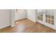 Bright living area with hardwood floors, white trim, and French doors at 809 Dobby Way (Lot 94), Mcdonough, GA 30252