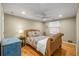 Bedroom with a floral patterned bed, hardwood floors, neutral walls and window with blind at 19 Lullwater Ne Pl, Atlanta, GA 30307