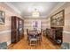 Classic dining room featuring hardwood floors and a stylish light fixture at 19 Lullwater Ne Pl, Atlanta, GA 30307