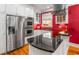 Stylish kitchen features stainless steel appliances, custom cabinetry, and dark countertops at 19 Lullwater Ne Pl, Atlanta, GA 30307