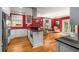 Spacious kitchen with white cabinetry, stainless steel appliances, and a cozy sitting area at 19 Lullwater Ne Pl, Atlanta, GA 30307